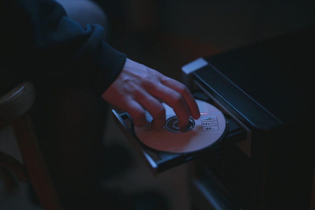 Man is using CD drive in his PC to play games